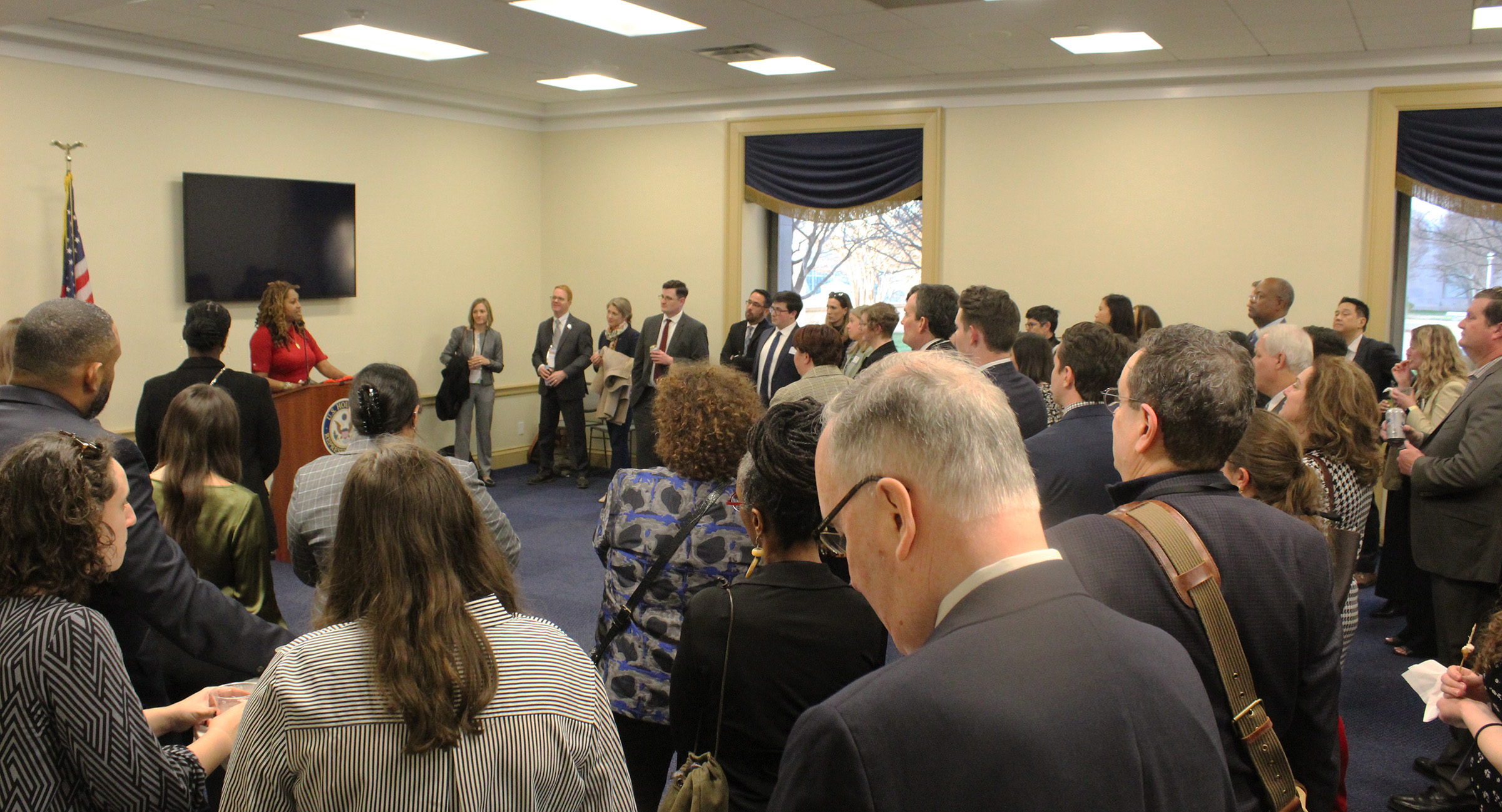 A crowd gathers to hear introductory remarks from Akilah Watkins, the President and CEO of Independent Sector