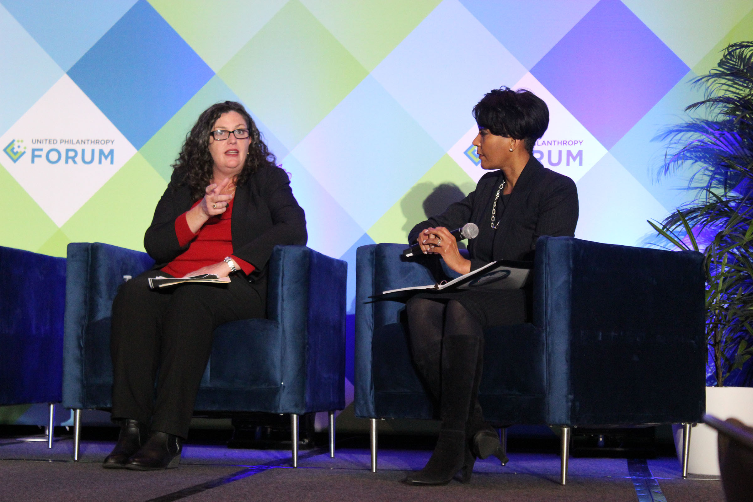 Kathleen Enright and Keisha Lance Bottoms chat during a panel