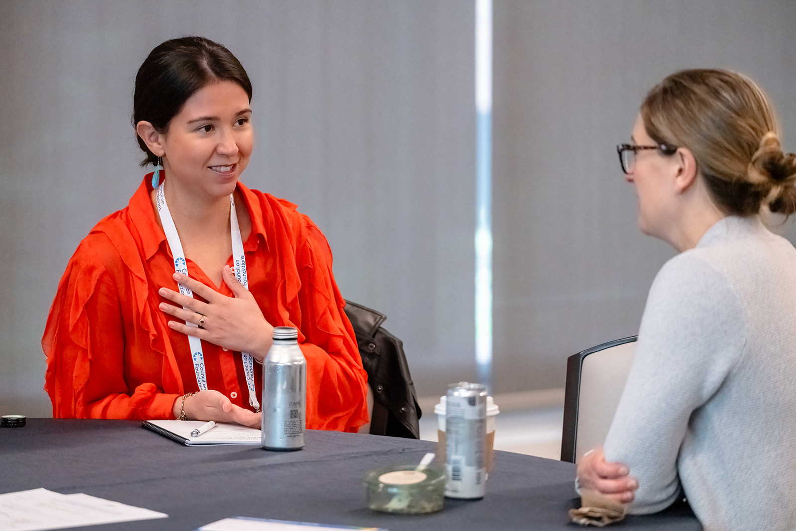 Two conference attendees in dialogue at Building Together 2026