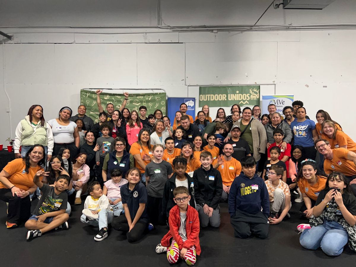 Outdoor Unidos, group photo at indoor event
