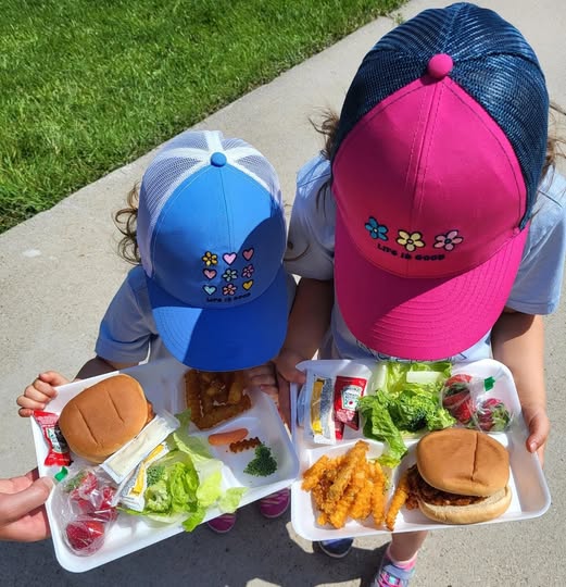 Black Hills Community Foundation, two children in ballcaps holding meal trays