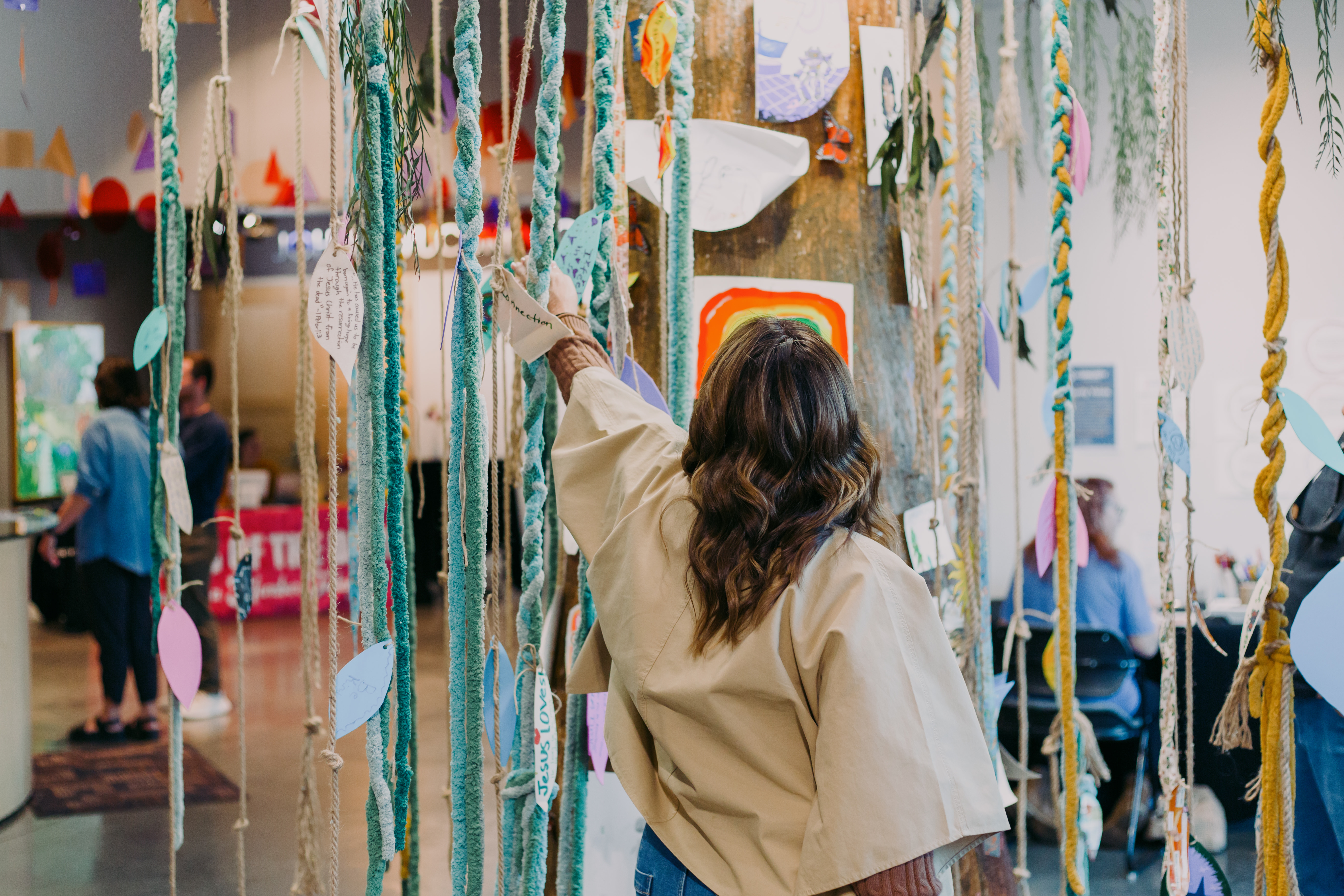 Black Hills Community Foundation mental health initiatives. Woman walking through art installation