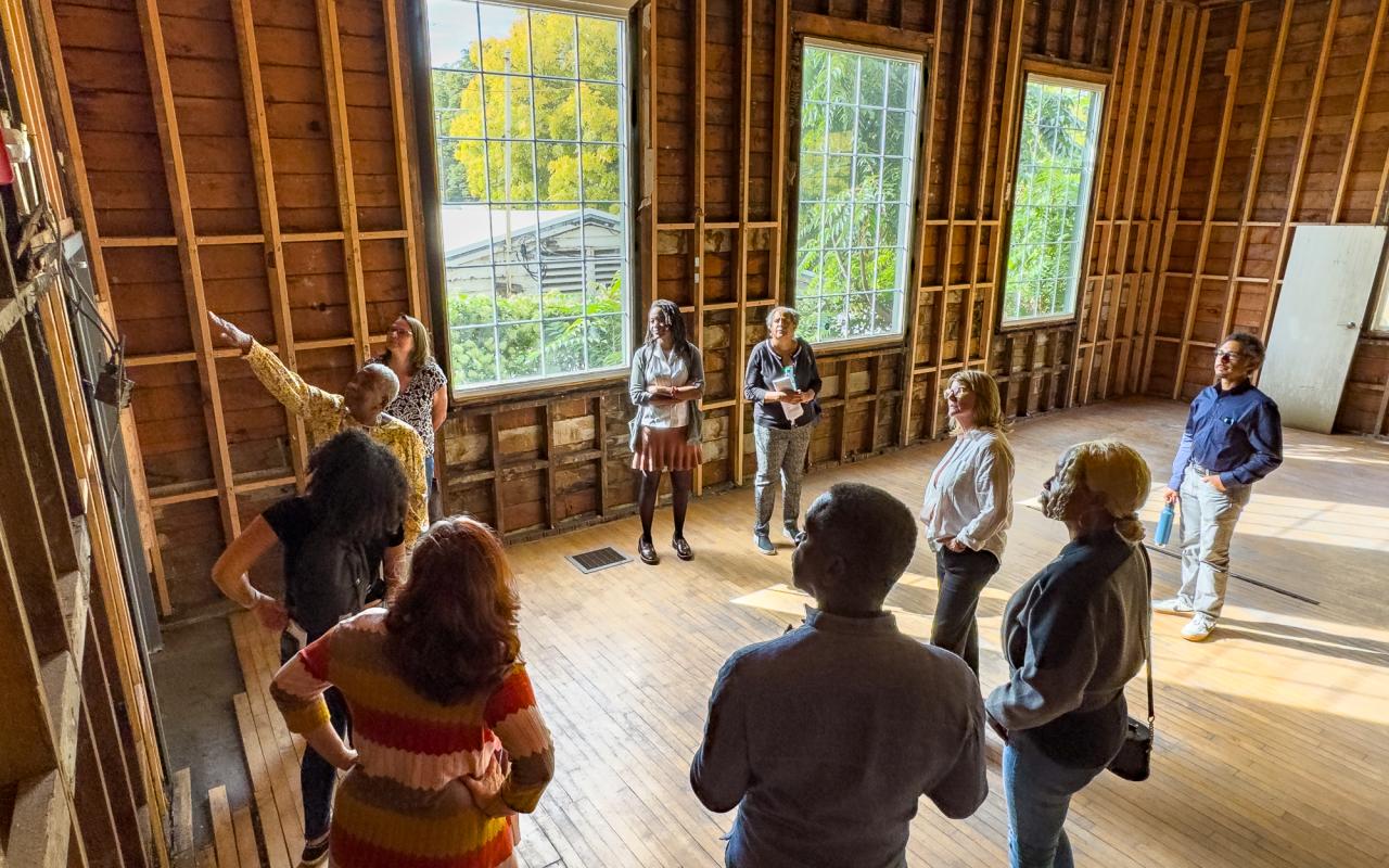 Deborah Roache shows renovation progress during a tour of Albina