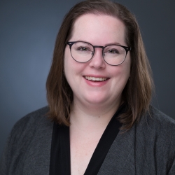 Sophie McNeil Wolf Picture of Sophie McNeil Wolf, wearing glasses smiling